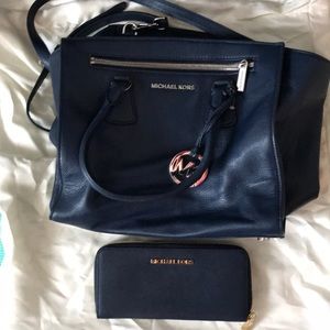 Barely used navy Michael Kors bag and wallet